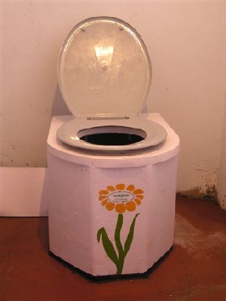 Seated urine diverting compost toilet